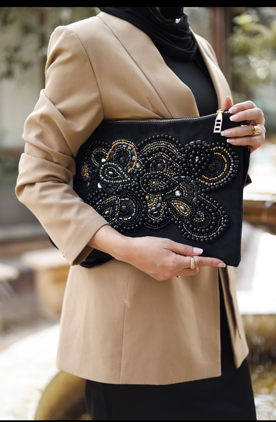 Black artwork embroidered clutch bag