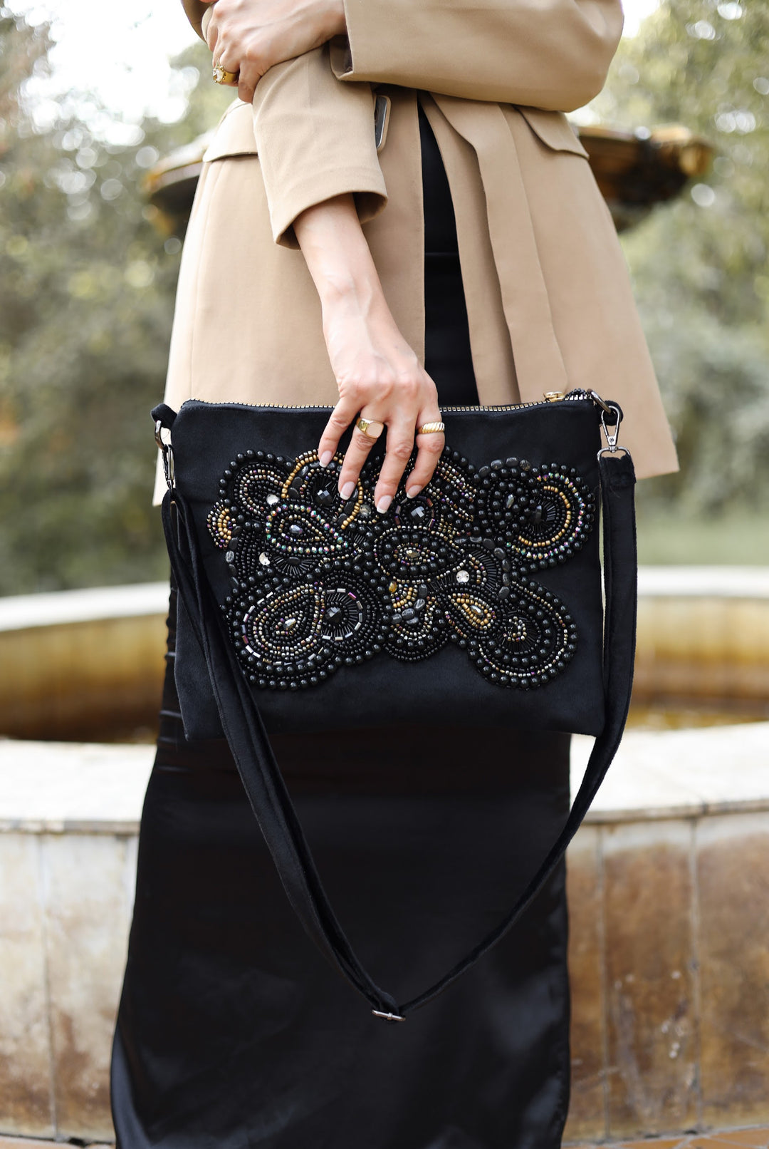 Black artwork embroidered clutch bag