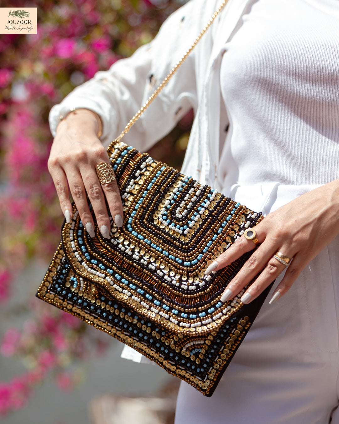 Hand-embroidered black clutch