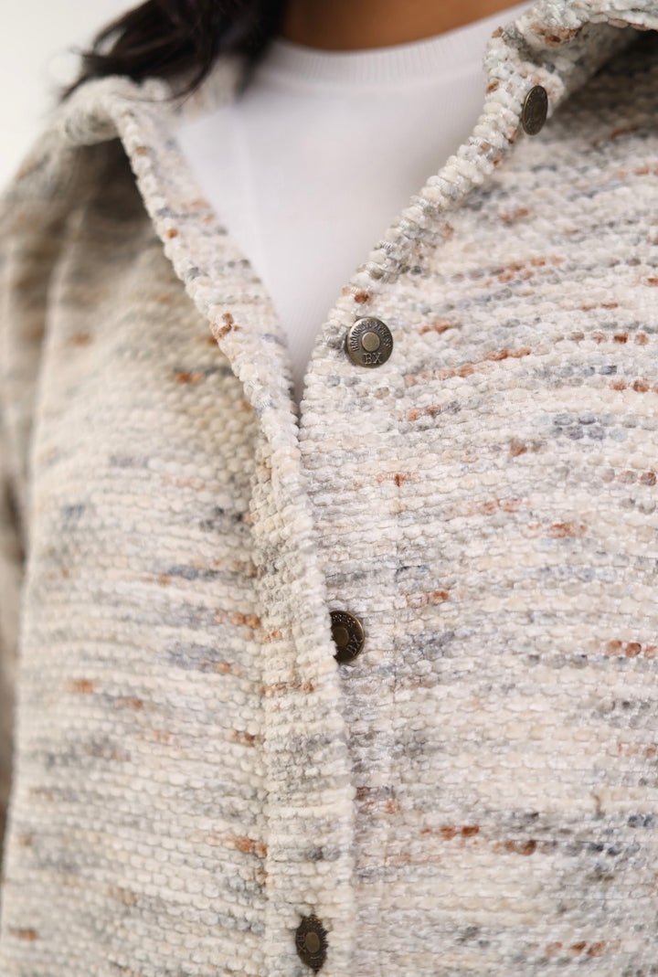 White pocket x light brown jacket