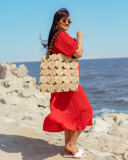 A Rectangular Wicker Bag Braided With Hand-Shaped Beads