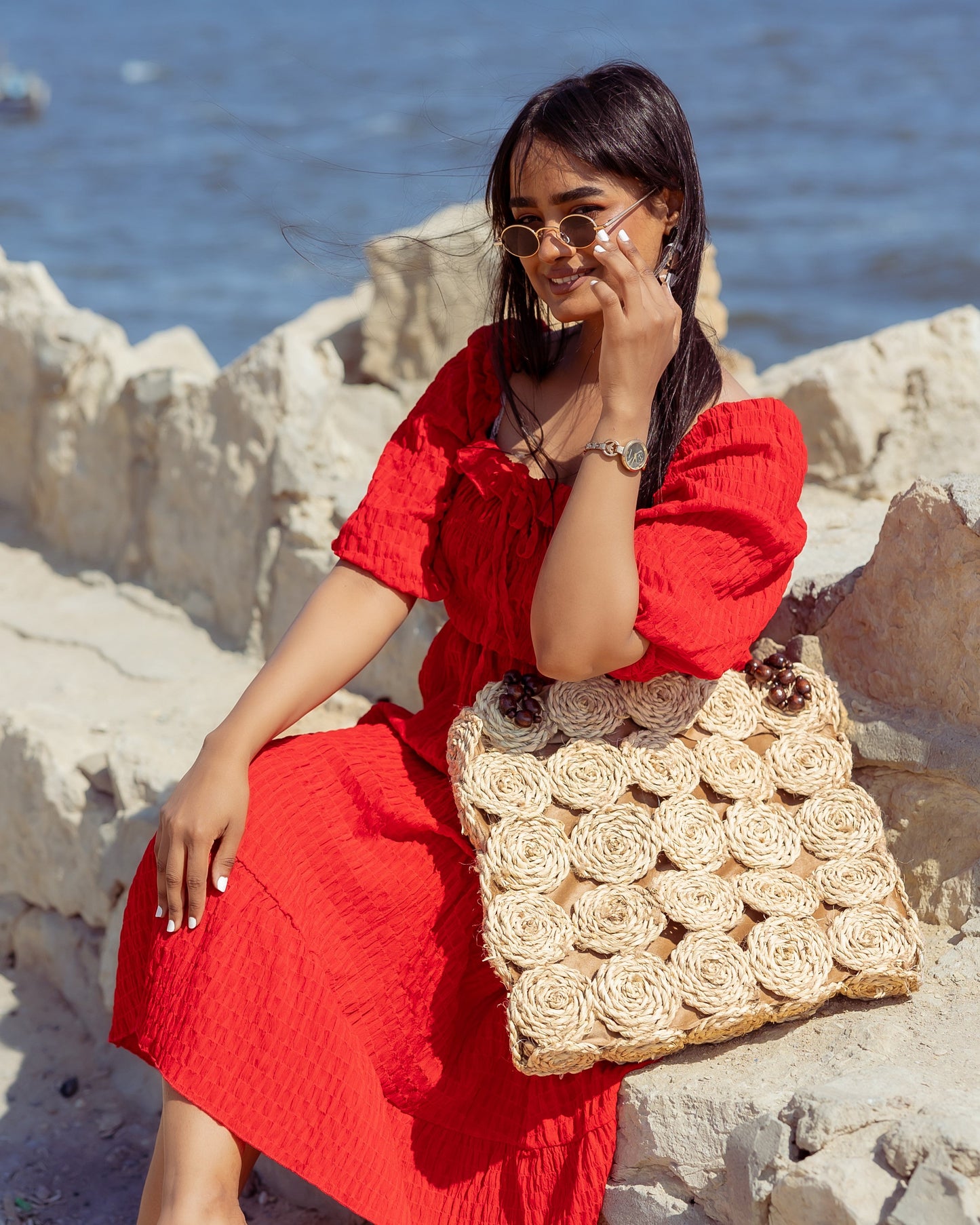 A Rectangular Wicker Bag Braided With Hand-Shaped Beads