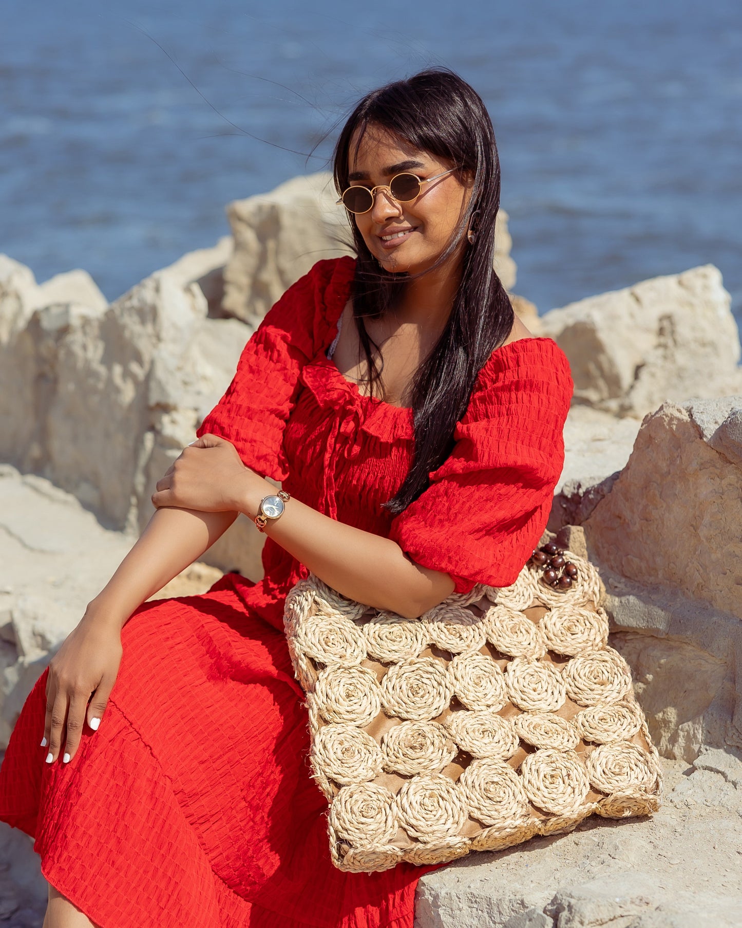 A Rectangular Wicker Bag Braided With Hand-Shaped Beads